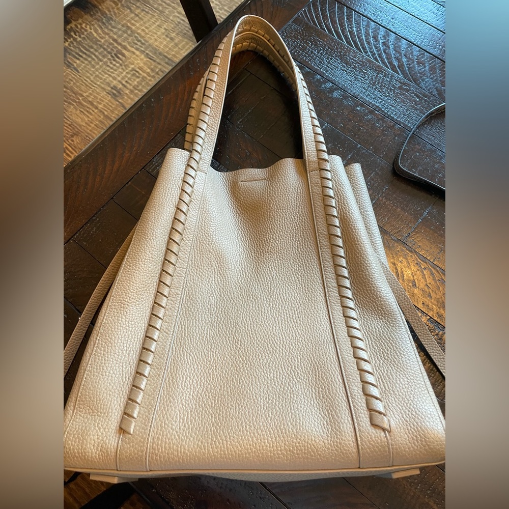 Allsaints bag in excellent condition.  Beautiful taupe color.Dust bag included.